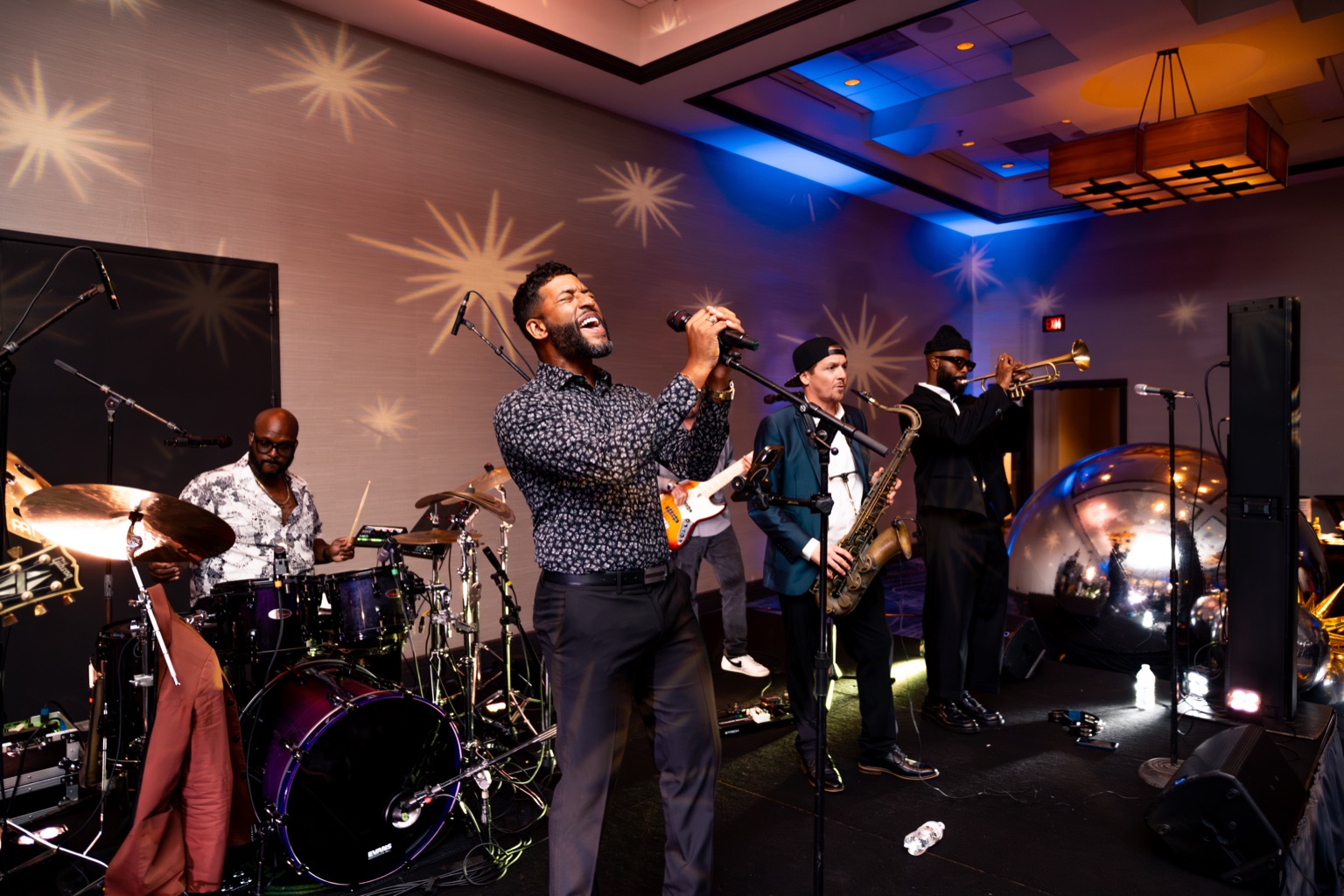 Jacksonville corporate event photography — live band vocalist performance