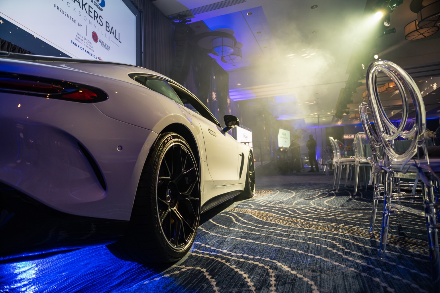 Jacksonville corporate event photography — luxury car display at gala